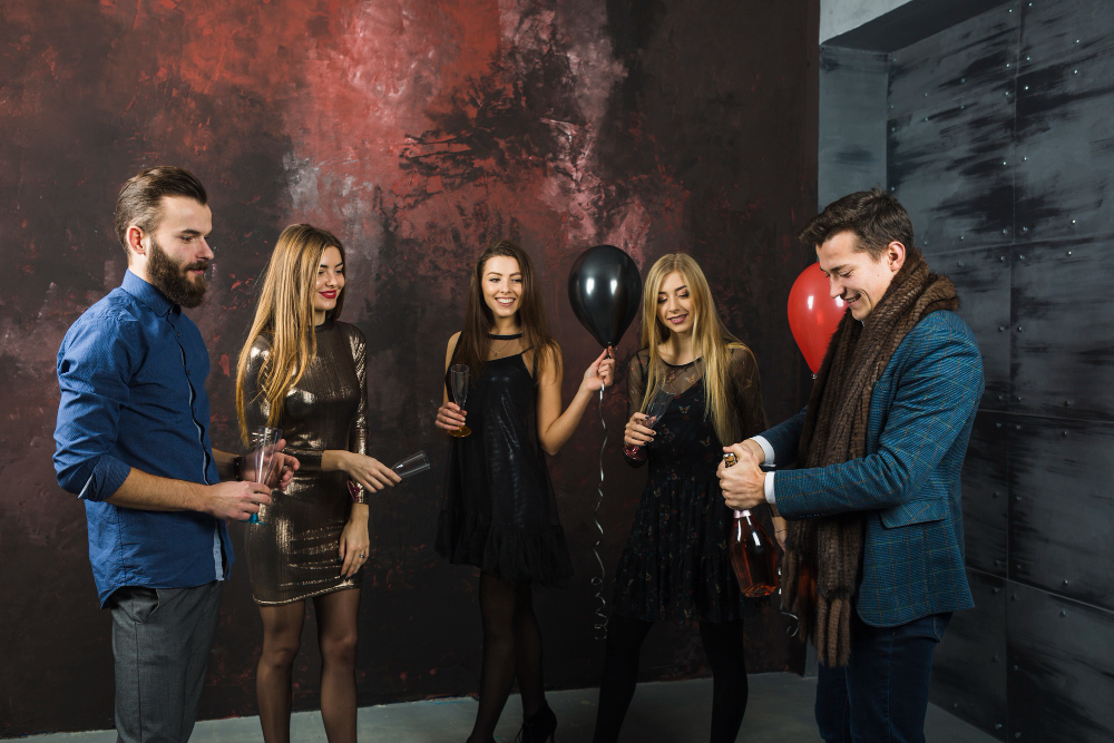 Photo booth New Orleans guests celebrating at private party with drinks and balloons